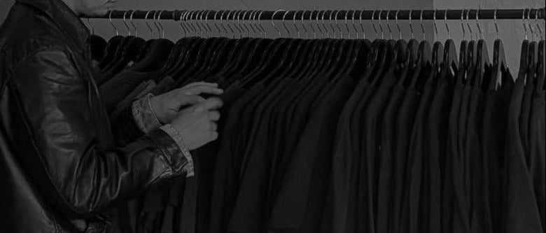 Customer looking through rack of curated vintage clothing from PICK MY BONES